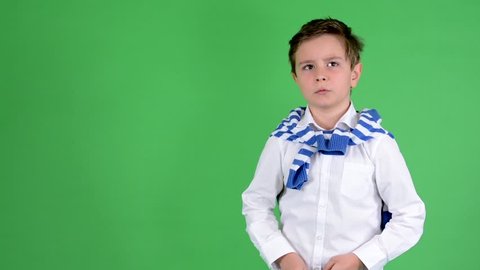 young handsome child boy talks to camera - green screen - studio