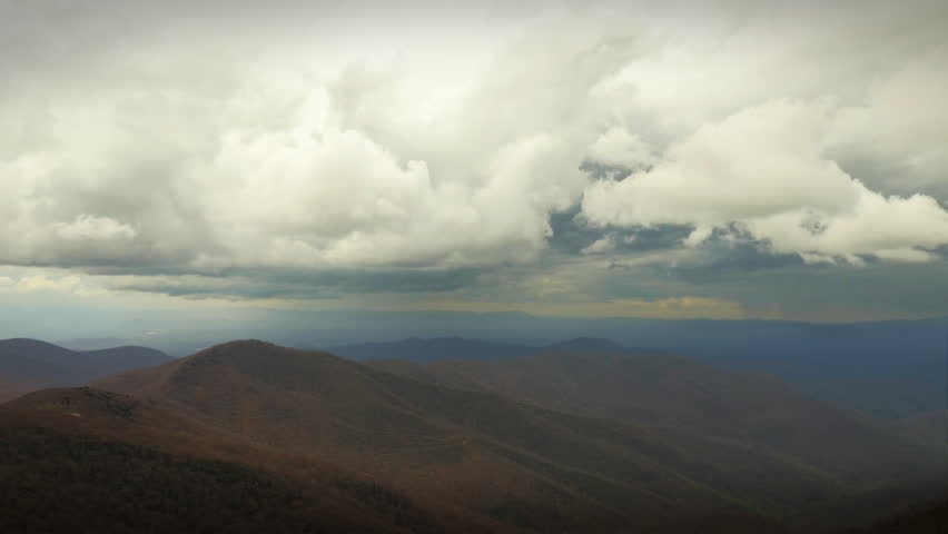 Mountain Valley Time Lapse Winter (Blue Ridge Parkway, North Carolina). Story clouds rolling in at the end of the winter over the brown, cold landscape.