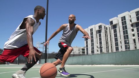 Two Basketball Players Playing One on One Outside with Scoring  – Stockvideo