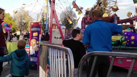 Coquitlam, BC, Canada - April 10, 2015 : People having fun at the West Coast Amusements Carnival