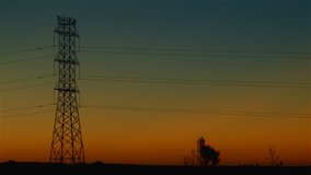 Energy Transmission Power Line Tower Pylon Structures at Sunset.
Power line structure used in electric power transmission and distribution to transmit electrical electricity along large distances. 
 - Powered by Shutterstock - Get 15% off with code: PIKWIZARD15