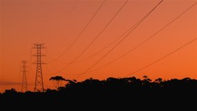 Energy Transmission Power Line Tower Pylon Structures at Sunset.
Power line structure used in electric power transmission and distribution to transmit electrical electricity along large distances. 
 - Powered by Shutterstock - Get 15% off with code: PIKWIZARD15