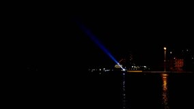 Powerful blue laser light at sea coast loop, HD stock video