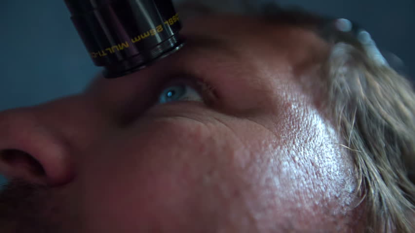 Looking at the sky with a telescope. Zooming in close up RAW footage of a man looking at the sky trough the telescope in observatory on a nice day.