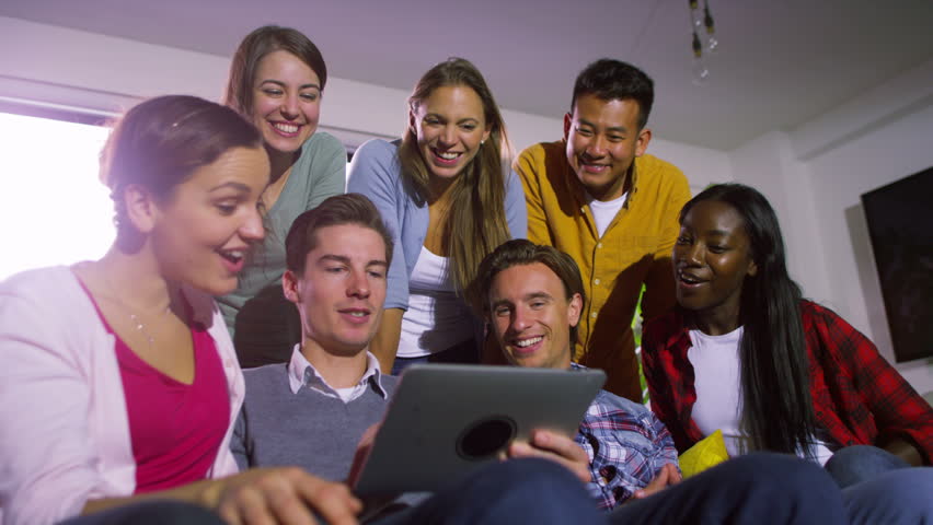 4K Cheerful group of young friends hanging out together with computer tablet | Shutterstock HD Video #9655514