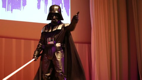 MOSCOW, RUSSIA - MARCH 28, 2015: Star Wars fan dressed as Darth Vader on stage during the festival Star Fans.