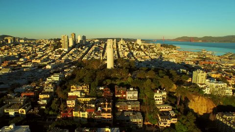 San Francisco Aerial v37 Flying low over Telegraph Hill and close to Coit Tower at sunrise.