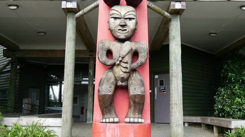 Tilt from the Maori statues standing at the Entrance to the Waitakere Regional Park