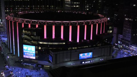 NEW YORK - APRIL 11: Madison Square garden in new York City beams colorful neon lights on the night of April 11, 2015. It is one of the major event locations in new York seen in 4K Ultra HD