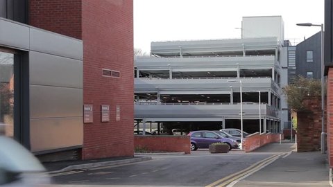 Side Shot Cars & Traffic Driving Past Multi-Story Car Park - Urban Scene
Road Town Scene - Transportation Backgrounds

Location: Lichfield, Staffordshire, UK
Source: Canon 5D Mkiii
Date: 6 March 2015