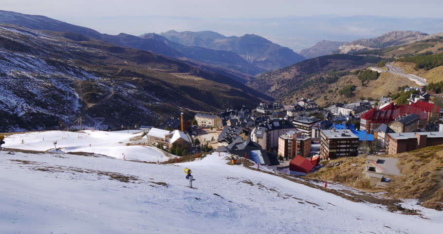 sierra nevada day time town view from ski resort top 4k spain
