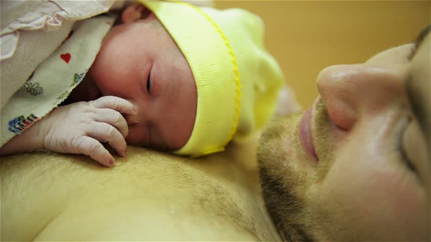 Young father with newborn child in the hospital after childbirth, Caesarian operation Royalty-Free Stock Footage #9678299