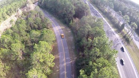 Chevrolet C ten gold pickup hot-rod truck driving on the forest road. Aerial footage.