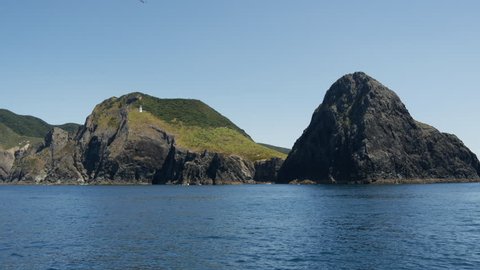 Sailing away from The Hole in the Rock at Percy Island/Motuk?kako Bay of Islands, New Zealand
