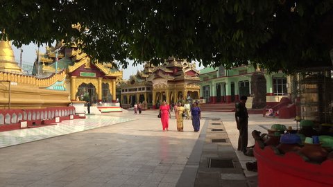 BAGO, BAGO REGION/MYANMAR - FEBRUARY 07, 2015: Unidentified Burmese women visit Bago Shwemawdaw Pagoda, Burma. The name Shwemawdaw means Great Golden God.