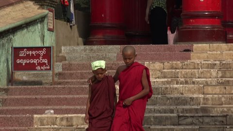 BAGO, BAGO REGION/MYANMAR - FEBRUARY 07, 2015: Unidentified Buddhist monks at Bago Shwemawdaw Pagoda, Burma. The name Shwemawdaw means Great Golden God.