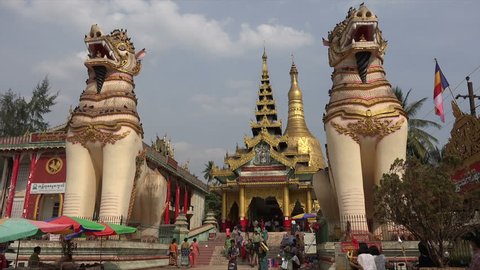 BAGO, BAGO REGION/MYANMAR - FEBRUARY 07, 2015: Unidentified people visit Bago Shwemawdaw Pagoda entrance, Burma. The name Shwemawdaw means Great Golden God.