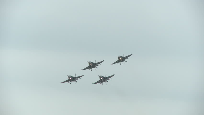 F18 Hornets in a fourship formation flight in the landing configuration