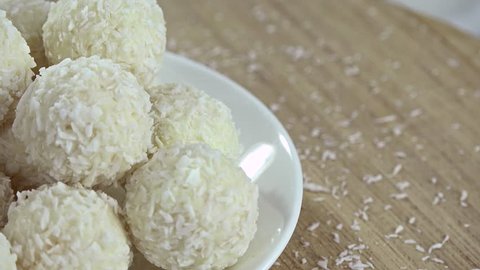 Portion of fresh made Coconut Pralines (seamless loopable 4K footage)