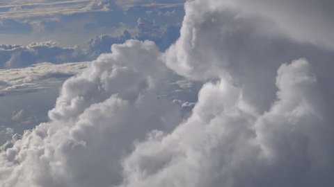 4K Hd Ultra, Traveling by air. Wonderful view of the sky and clouds with the light the sun from above, as seen through an airplane window-Dan