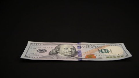 Money Dollars. Bill lying on the black table. translation focus