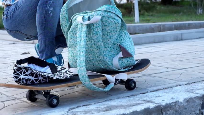 Urban action sports sequence: youthful skateboarder executes dynamic tricks on smooth concrete plaza during daytime, creating flowing visual energy and motion. The subject
