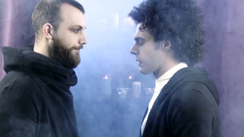 Two handsome male vampires fighting ready to kill each other 