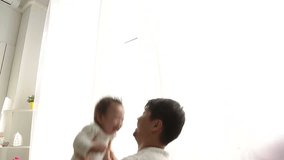 father playing with adorable baby