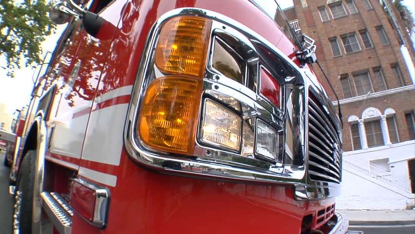 This is a close up, fish-eye shot of a Los Angeles County Firetruck parked in an