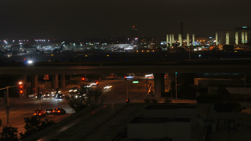This is a time lapse shot of Pacific Cost Highway and the LAX Airport at night. 