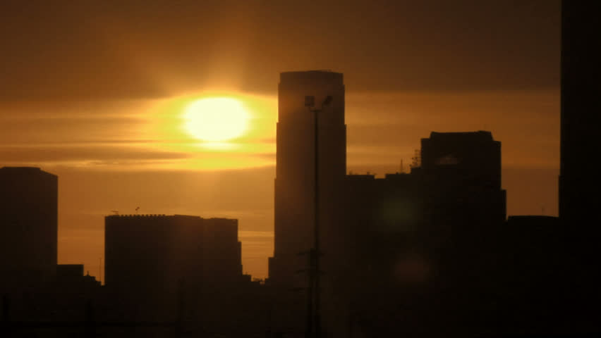 The sun sets on Los Angeles in silhouette
