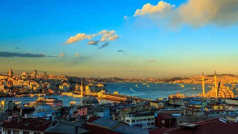 ISTANBUL - APRIL 02: Panoramic view over Istanbul during golden hour with view at the Galata Bridge, Yeni Mosque and Boat Traffic. Time Lapse in 4K. April 02, 2015 in Istanbul, Turkey. 