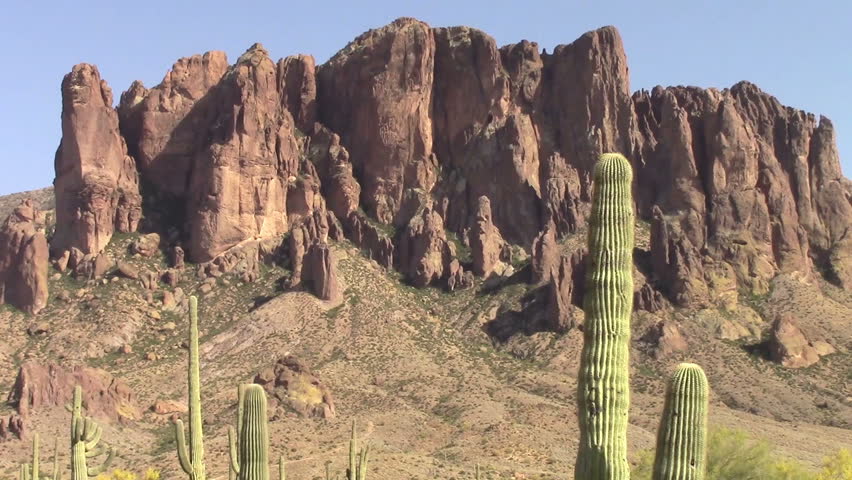 Zoom out, Superstition Mountains located in Lost Dutchman State Park, Arizona. The park is famous for the legend of a gold mine  in the park found by a German immigrant named Jacob Waltz back in 1891.