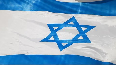 Israeli national flag fluttering on a wind