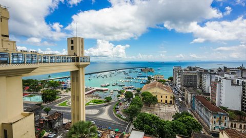 Salvador da Bahia, Brazil, time lapse view of Lacerda Elevator and All Saints Bay (Baia de Todos os Santos) on a beautiful summer day.