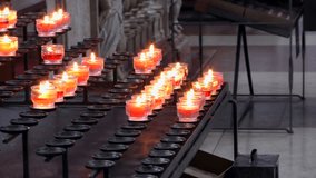 4K footage of burning candles in the Salzburg Cathedral in Salzburg, Austria. Salzburg Cathedral (German: Salzburger Dom) is the seventeenth-century Baroque cathedral.