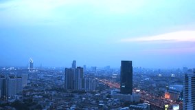 BANGKOK, Thailand - April 2015: Time lapse view of Bangkok skyline at sunset