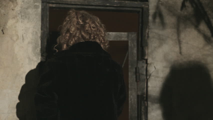 Frightened woman in tears trying to escape from the maniac at night