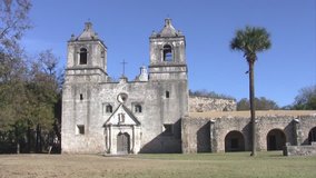 Video pan right of old Spanish Mission Concepcion San Antonio, Texas. Built early 1700â€™s by missionaries from Spain and local Indians. Two bell towers with cathedral and rock well and stone walls. 