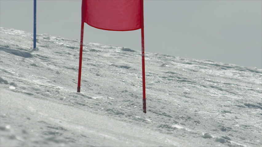 SLOW MOTION: Slalom skier turning around the gates