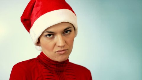 Sad woman in santa cap 