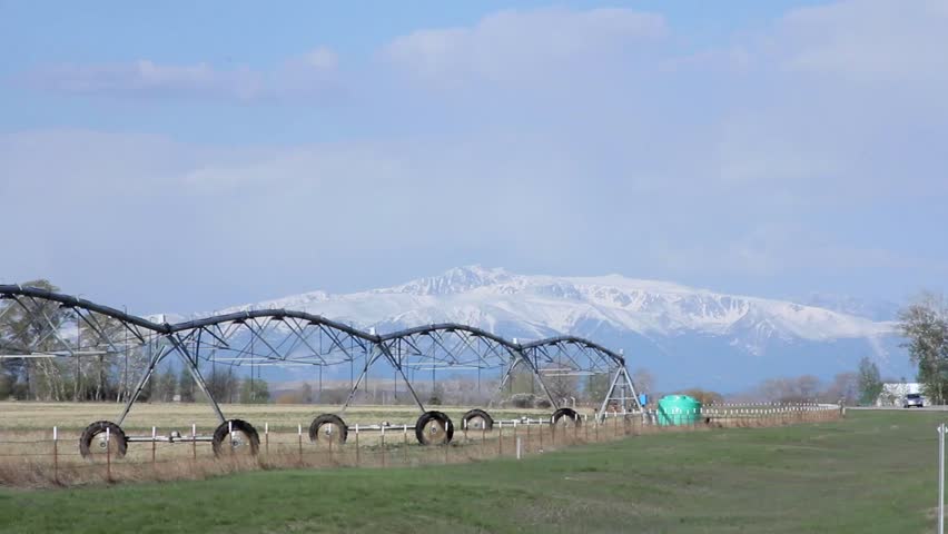 Yellow car driving down one of Montana
