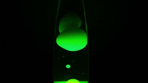 Close up of a lava lamp in action with green wax. Full 1080p resolution, 25 fps, 25 MBit/s, Motion JPEG-B codec