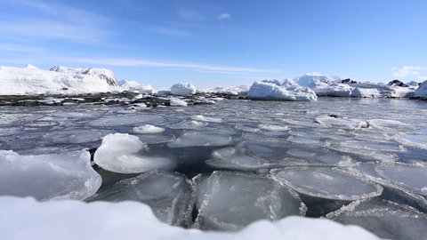 Beautiful Arctic winter landscape - pancake ice - freezing fjord
