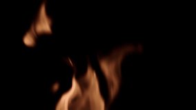Centered, close slow-motion flames recorded against a black background, suitable for compositing using a blending mode.  Looping clip, 16 seconds recorded in 1080/24P at 180fps.