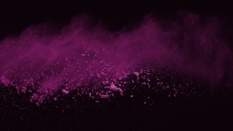 Powder flying in midair against black background. Shot with high speed camera, phantom flex 4K. Slow Motion. Unedited version is included at the end of clip.