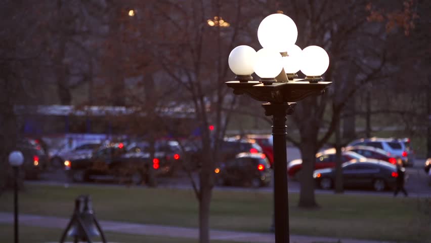 A streetlight shines in downtown Denver, CO.