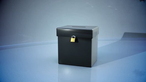 ballot box with votes flying into it 