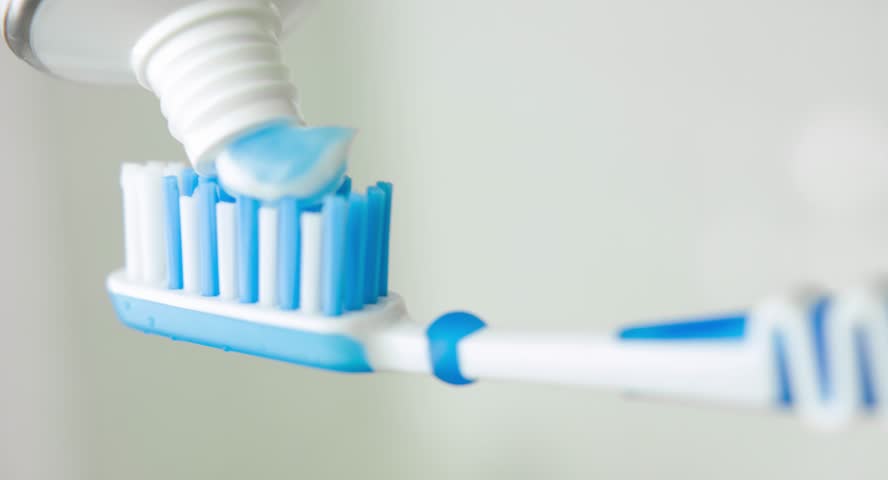 toothpaste on toothbrush