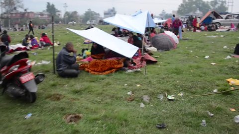 KATHMANDU, NEPAL - APRIL 26, 2015: People stay in tents in a makeshift camp in  Chuchepati area after the 7.8 earthquake that hit Nepal on 25 April 2015.